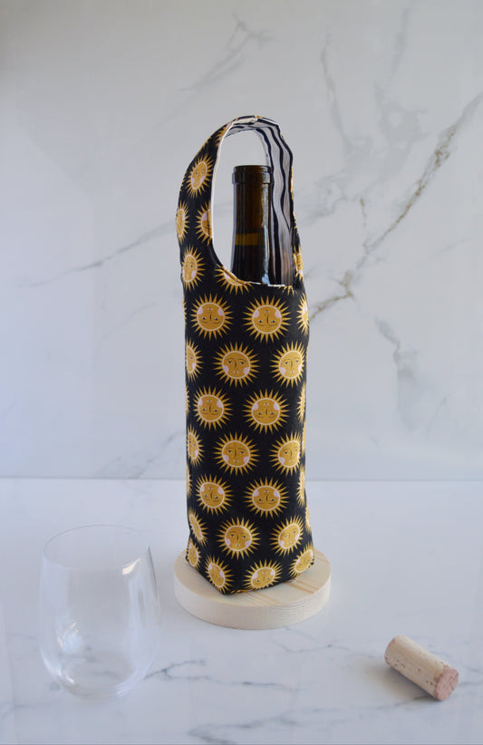 black wine bag with gold suns