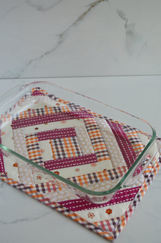 quilted hotpad with fall fabric and pyrex baking dish