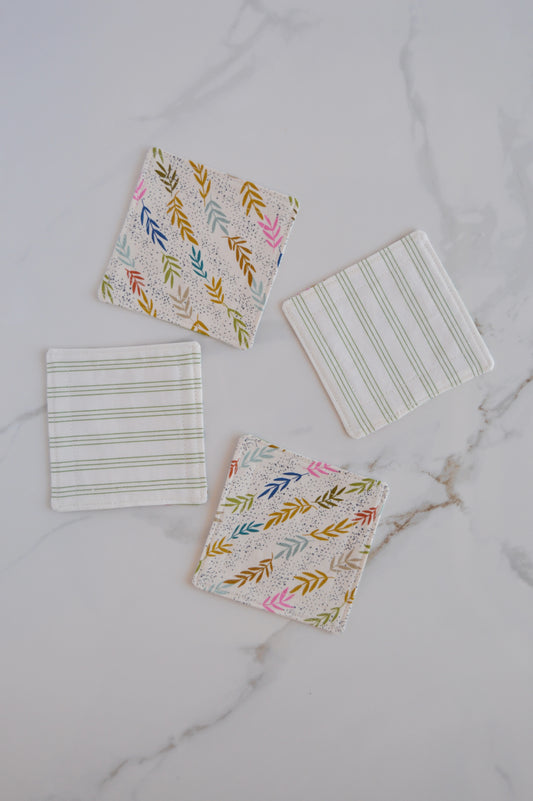 set of four reversible coasters with stripes and leaves