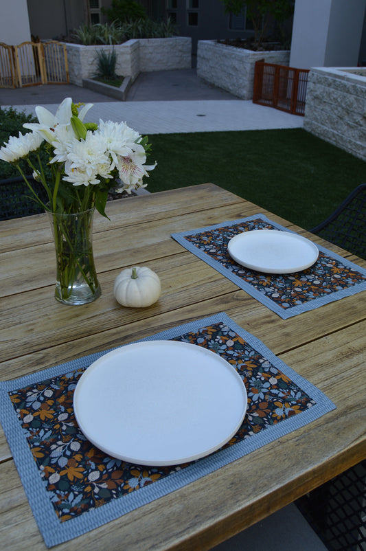 picnic table setting with gold leaves fall placemats